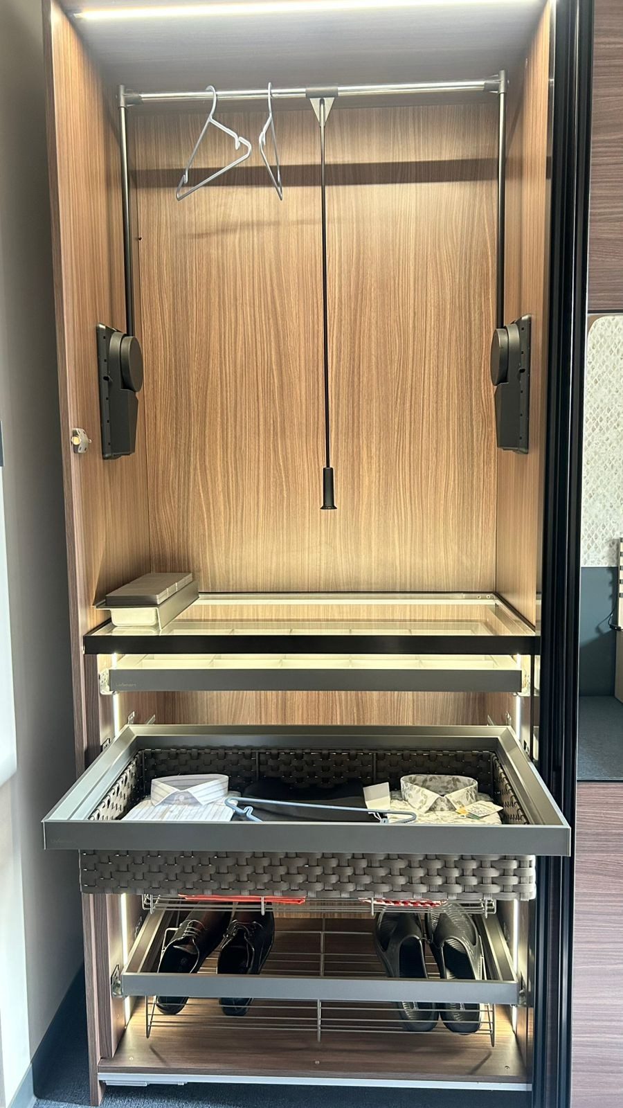 Wardrobe interior pull-down rail