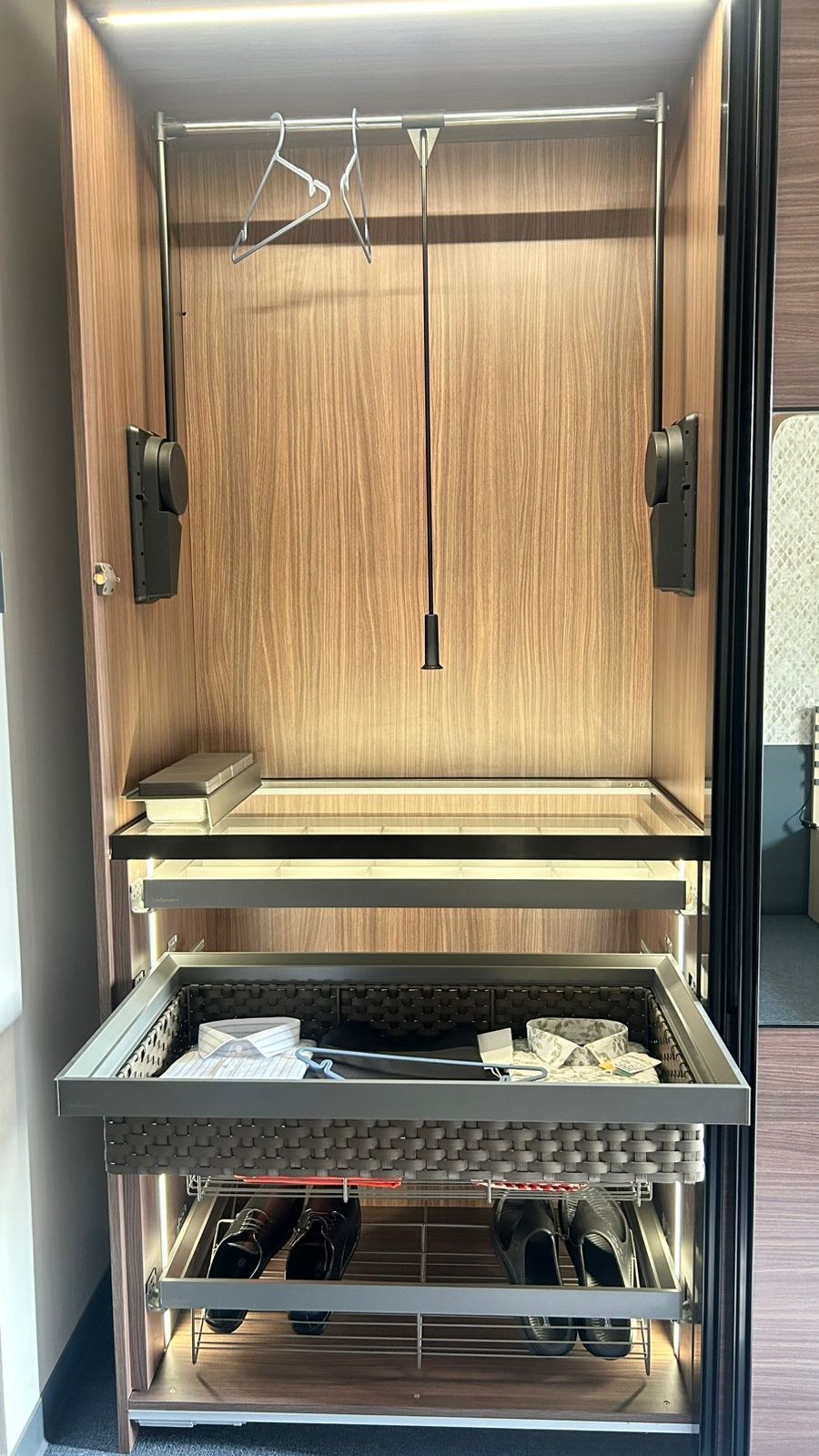 Wardrobe interior pull-down rail